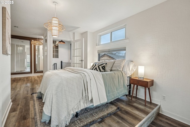 bedroom with dark wood-type flooring