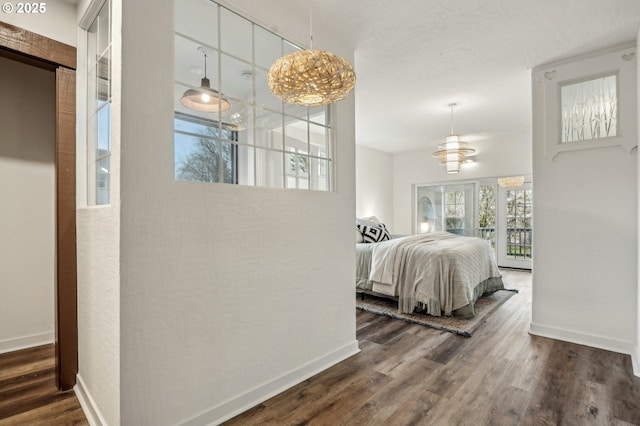 bedroom with dark wood-type flooring