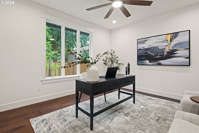 home office featuring ceiling fan and dark wood-type flooring