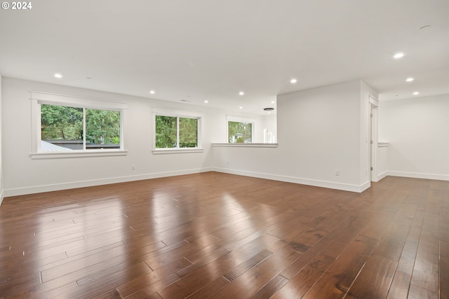 empty room with dark wood-type flooring