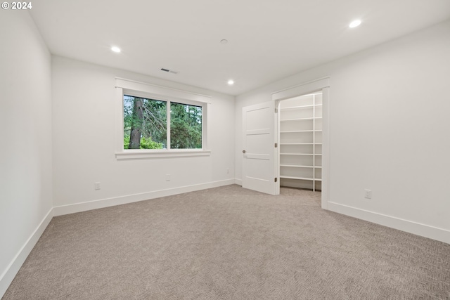 empty room featuring light carpet