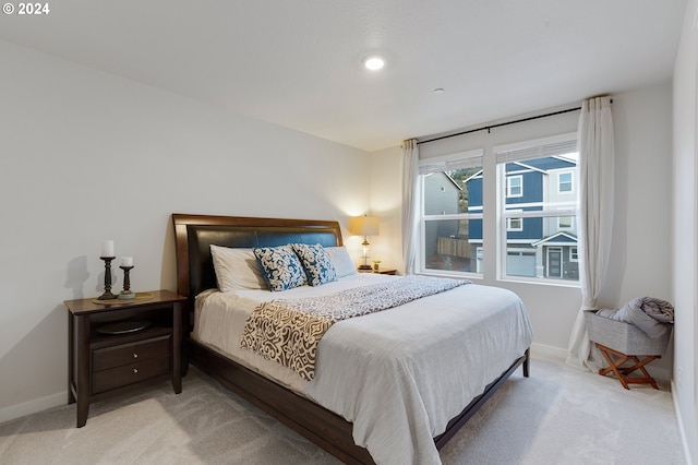 bedroom with light colored carpet