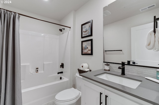 full bathroom with shower / bathtub combination with curtain, vanity, and toilet