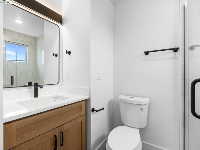 758 NE 91st Ave Unit 1, Portland, OR 97220 - bathroom with toilet, vanity, and a shower stall