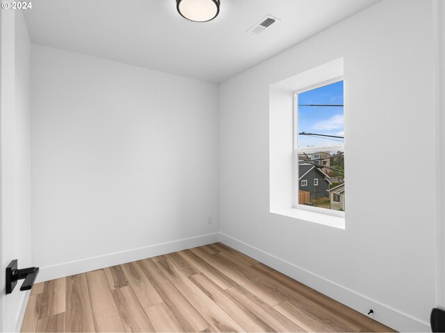 758 NE 91st Ave Unit 1, Portland, OR 97220 - unfurnished room featuring baseboards, light wood-style flooring, and visible vents