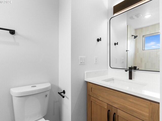 758 NE 91st Ave Unit 1, Portland, OR 97220 - bathroom featuring visible vents, toilet, vanity, and walk in shower