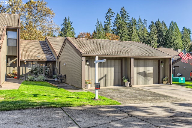 garage featuring a yard