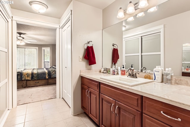 bathroom featuring vanity, tile patterned flooring, and ceiling fan