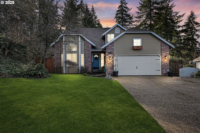 traditional-style house with a front yard, fence, concrete driveway, and brick siding