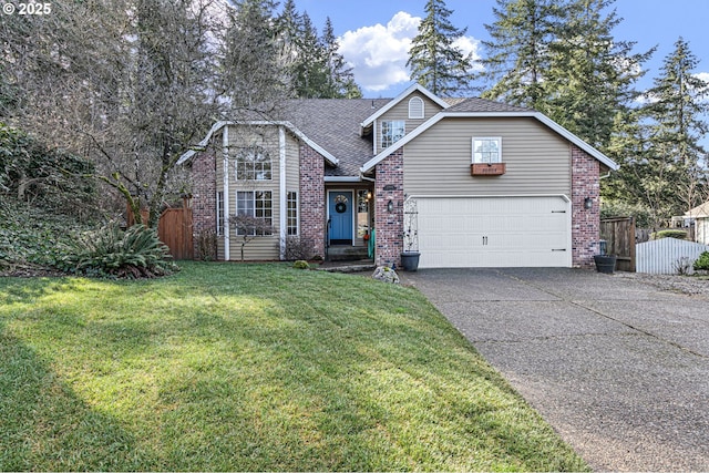 traditional-style home featuring driveway, brick siding, a front yard, and fence