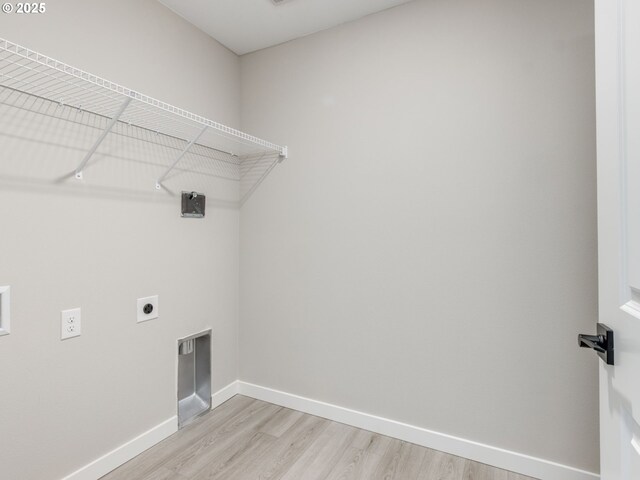838 NW 178th Way, Ridgefield, WA 98642 - clothes washing area with hookup for an electric dryer, light wood-style floors, baseboards, and hookup for a washing machine