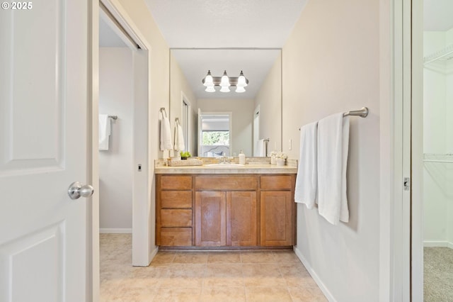 bathroom with tile patterned flooring and vanity