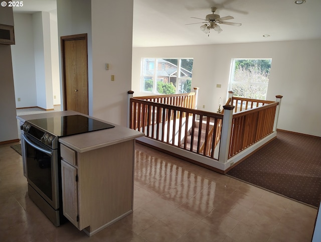 interior space featuring a ceiling fan