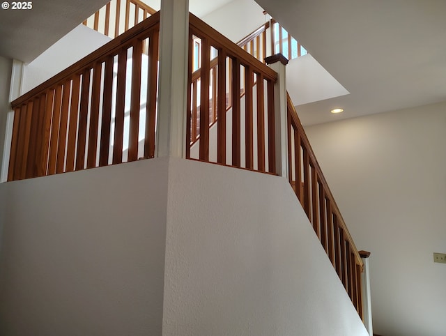 stairs featuring recessed lighting