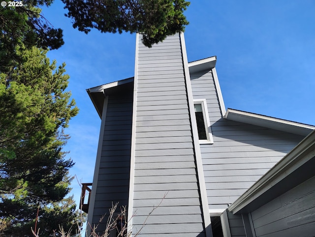 view of side of home with a chimney