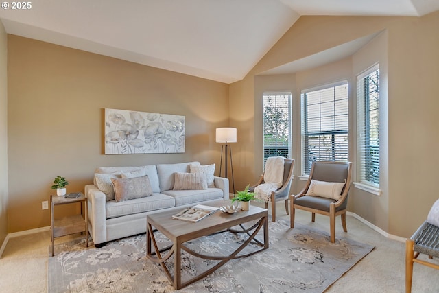 living room with light colored carpet and vaulted ceiling