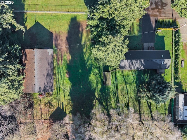 birds eye view of property with a rural view