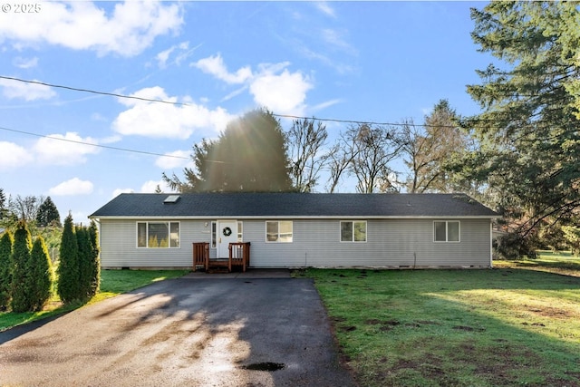 ranch-style home with a front lawn