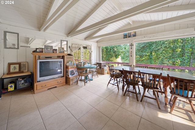 interior space with vaulted ceiling with beams