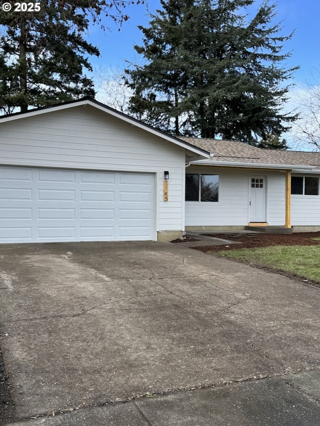 ranch-style house featuring a garage