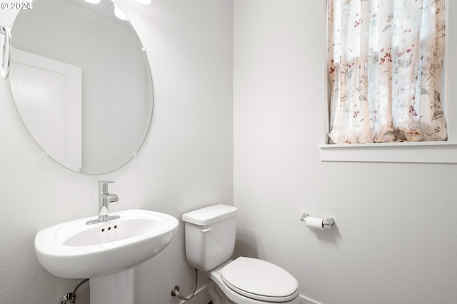 bathroom with sink and toilet