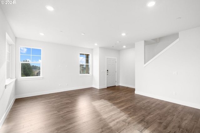 spare room featuring dark wood-type flooring