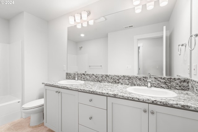 full bathroom with tile patterned floors, vanity, toilet, and shower / tub combination