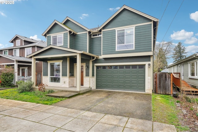 view of front of home featuring a garage, a porch, and concrete driveway