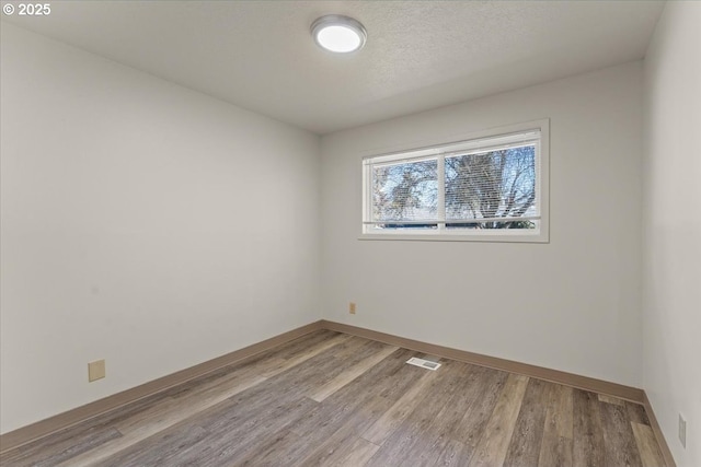18765 SW Kinnaman Rd, Beaverton, OR 97078 - unfurnished room with wood finished floors and baseboards