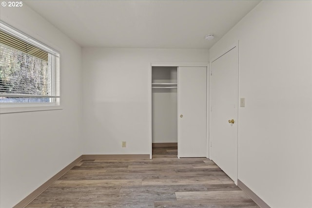 18765 SW Kinnaman Rd, Beaverton, OR 97078 - unfurnished bedroom with a closet and wood finished floors