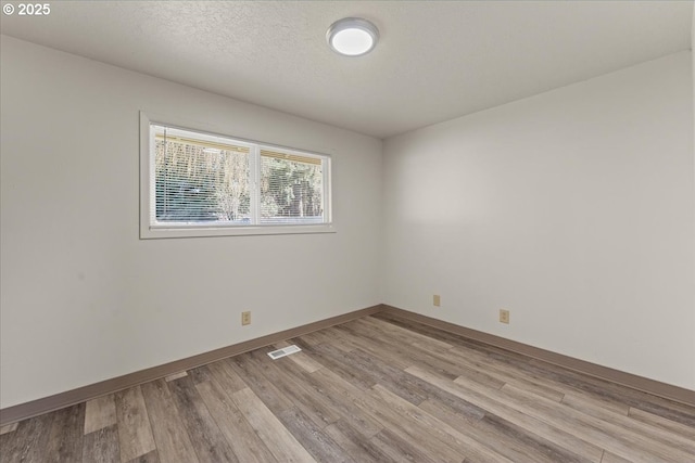 18765 SW Kinnaman Rd, Beaverton, OR 97078 - spare room featuring light wood finished floors and baseboards