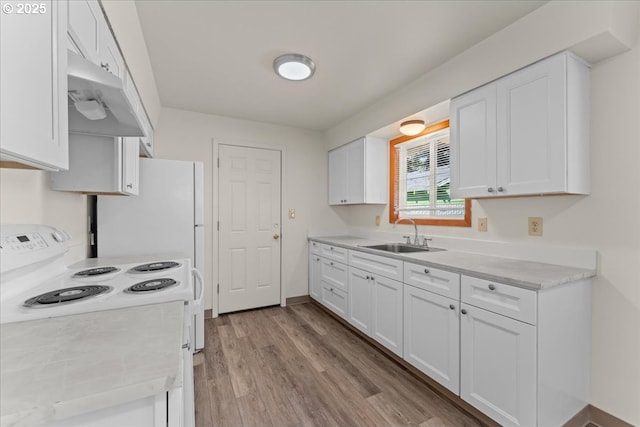 18765 SW Kinnaman Rd, Beaverton, OR 97078 - kitchen featuring electric range, a sink, white cabinetry, and light countertops