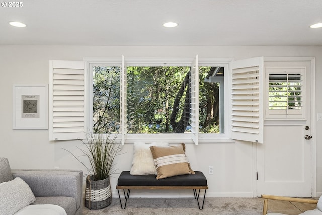 sitting room featuring carpet, baseboards, and recessed lighting