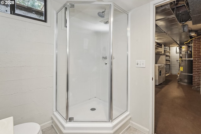 bathroom featuring toilet, a shower stall, and water heater