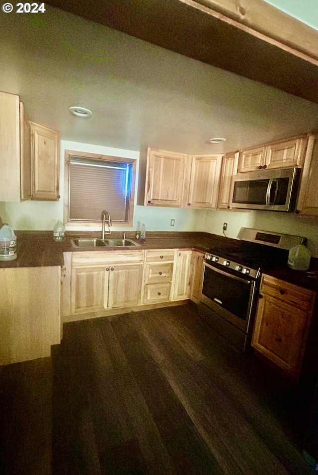 211 Jensen Quarry Rd, Bickleton, WA 99322 - kitchen featuring a sink, light brown cabinetry, stainless steel appliances, dark countertops, and dark wood-style flooring