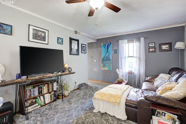 bedroom featuring ornamental molding, ceiling fan, and carpet