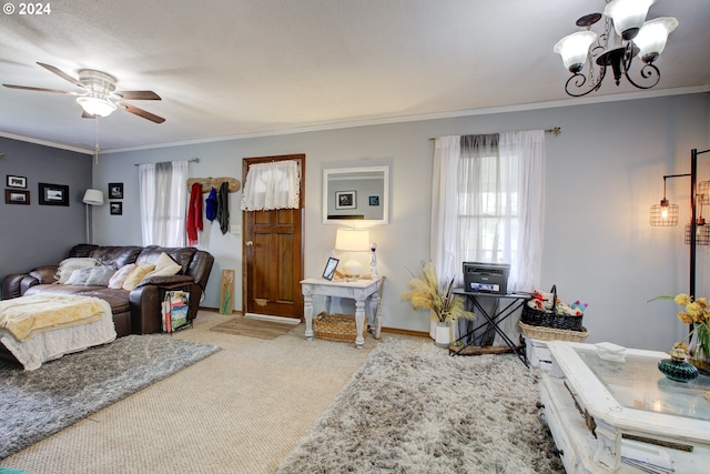 living room featuring crown molding, carpet, and ceiling fan with notable chandelier