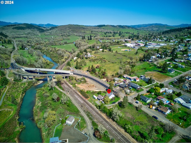 bird's eye view with a water and mountain view