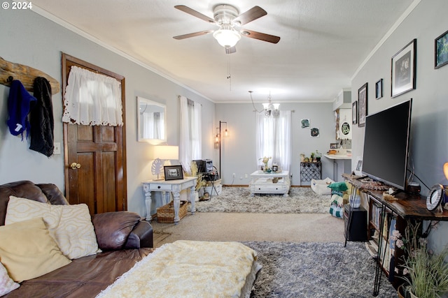 carpeted living room with ornamental molding and ceiling fan with notable chandelier