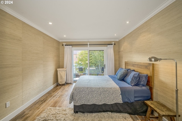 bedroom with light hardwood / wood-style floors, access to exterior, and ornamental molding