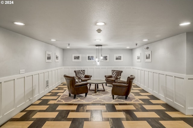 1829 NW Lovejoy St Unit 303, Portland, OR 97209 - living area featuring wainscoting, a decorative wall, visible vents, and recessed lighting