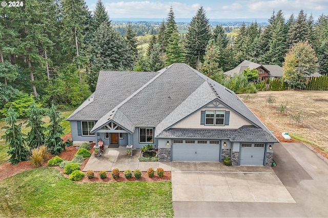 view of front of home featuring a garage and a front yard