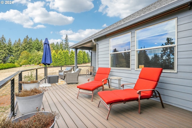 deck featuring outdoor lounge area