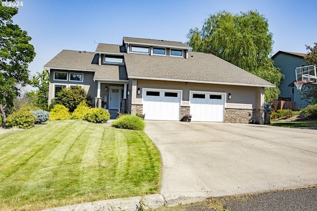 view of front of home featuring a garage and a front yard