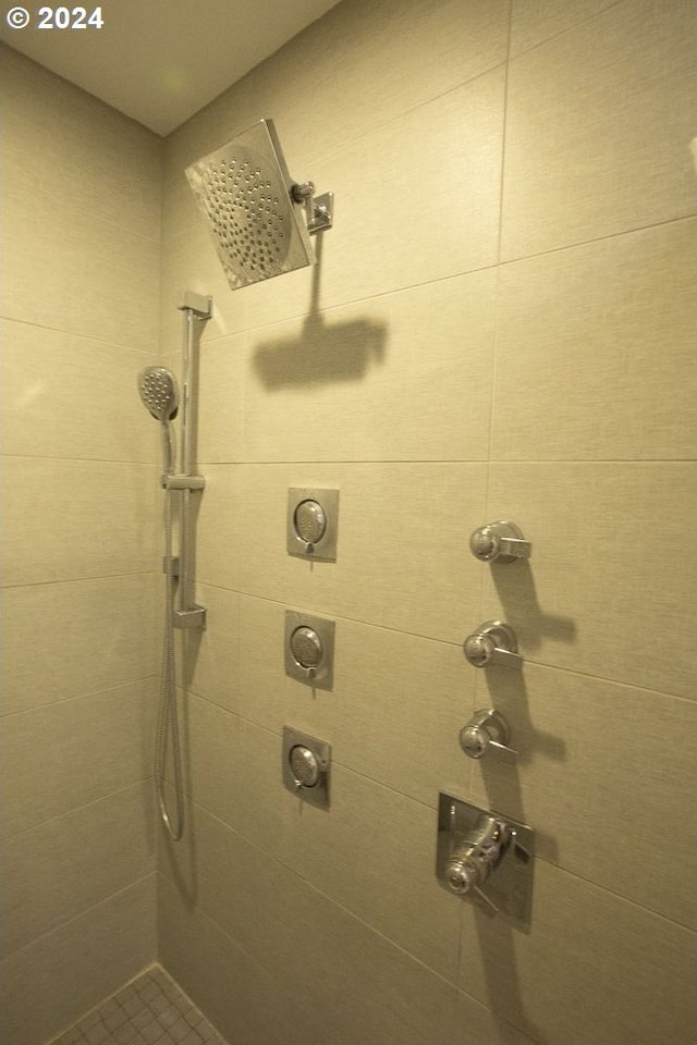 bathroom with tiled shower