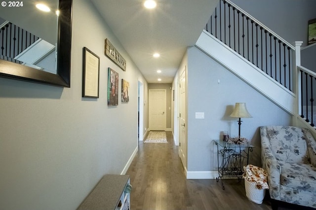 hall with wood-type flooring