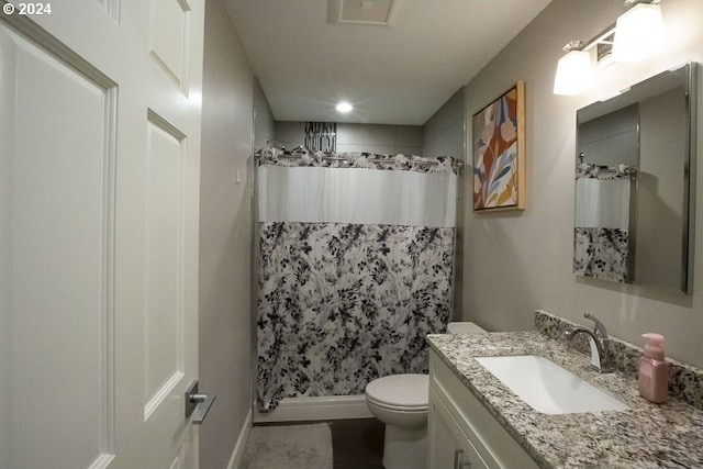 bathroom with vanity, toilet, and a shower with shower curtain