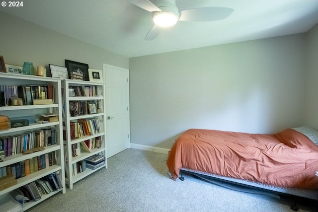 bedroom featuring ceiling fan and carpet