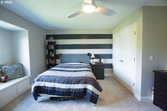 bedroom with light colored carpet and ceiling fan