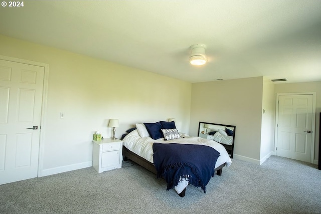 bedroom with light carpet